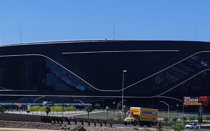The black exterior of Allegiant Stadium seen from the road