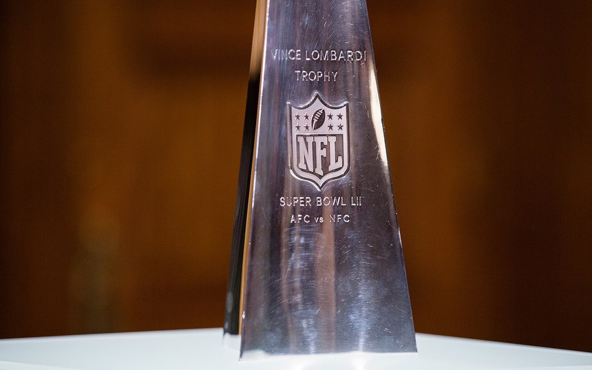 The Vince Lombardi Trophy on a stand, engraved SUPER BOWL LII AFC vs NFC